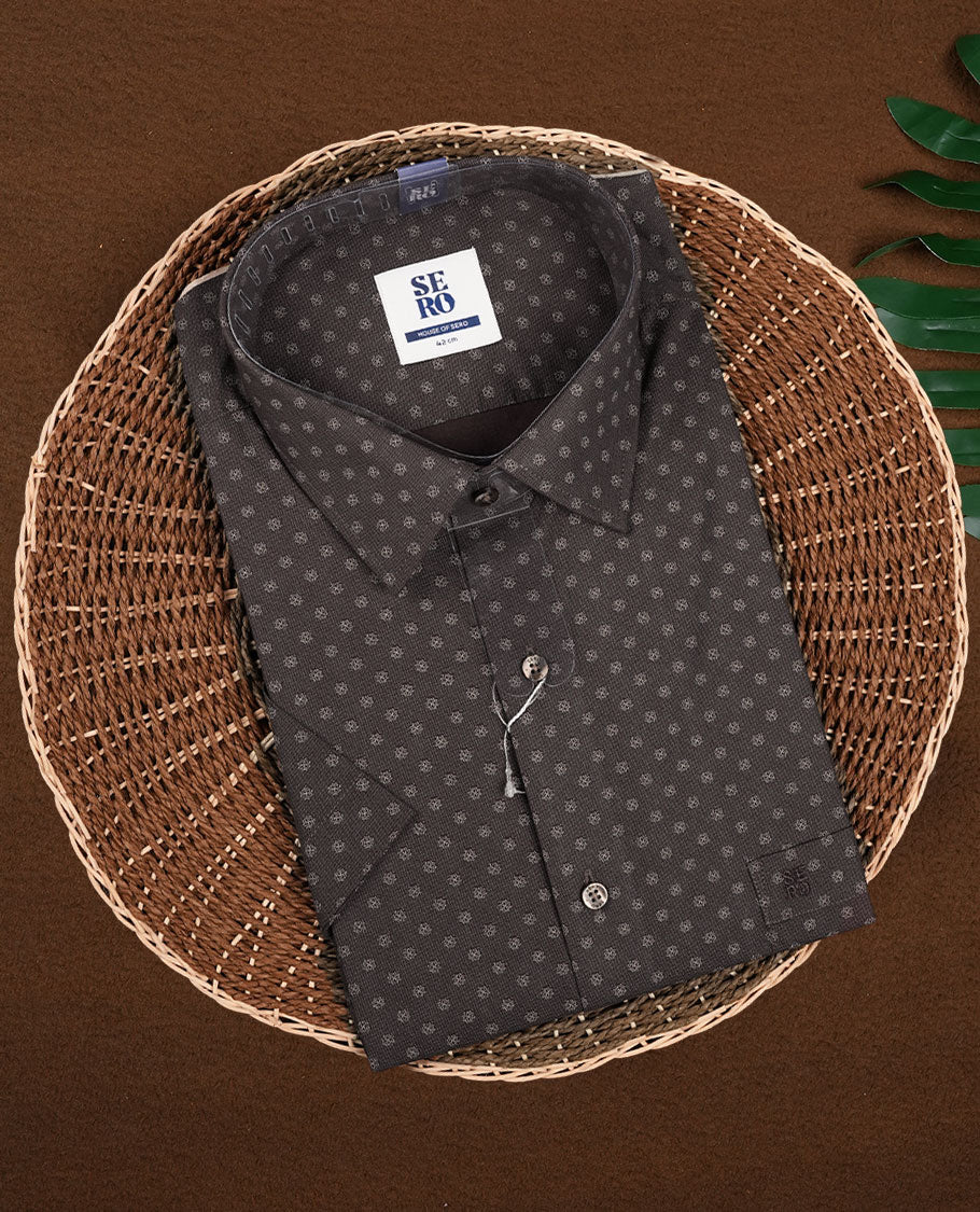 Brown colour printed short sleeve shirt with a classic spread collar, Made from soft, breathable fabric, it blends comfort and style perfectly.