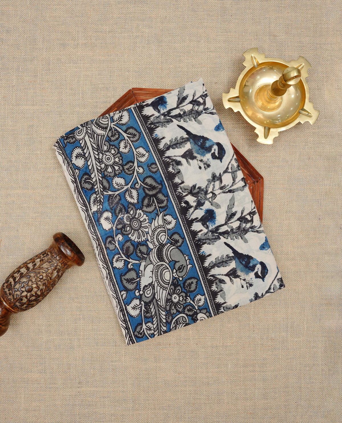 Cream & teal blue colour kalamkari cotton saree featuring kalamkari printed body & pallu, paired with a matching  contrast blouse piece.