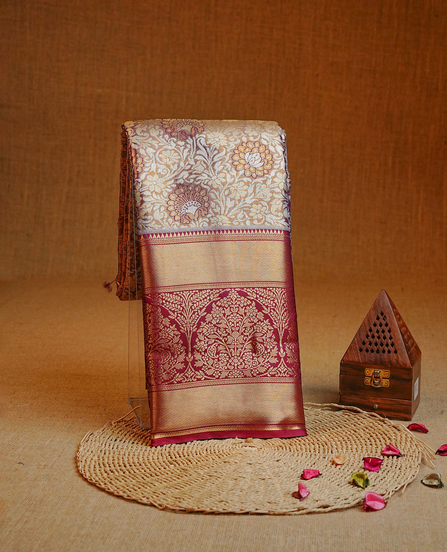 Gold & Maroon colour Double shade Semi tissue silk saree featuring Gold & silver Floral kodi pattern on body, Contrast Maroon colour with traditional border, paired with matching.