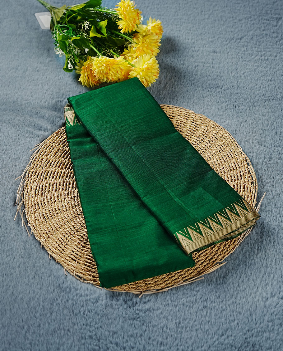 Dark green colour Narayanapattu cotton saree featuring a self coloured body, contrast Cream colour zari border and pallu, pairing a matching blouse piece.