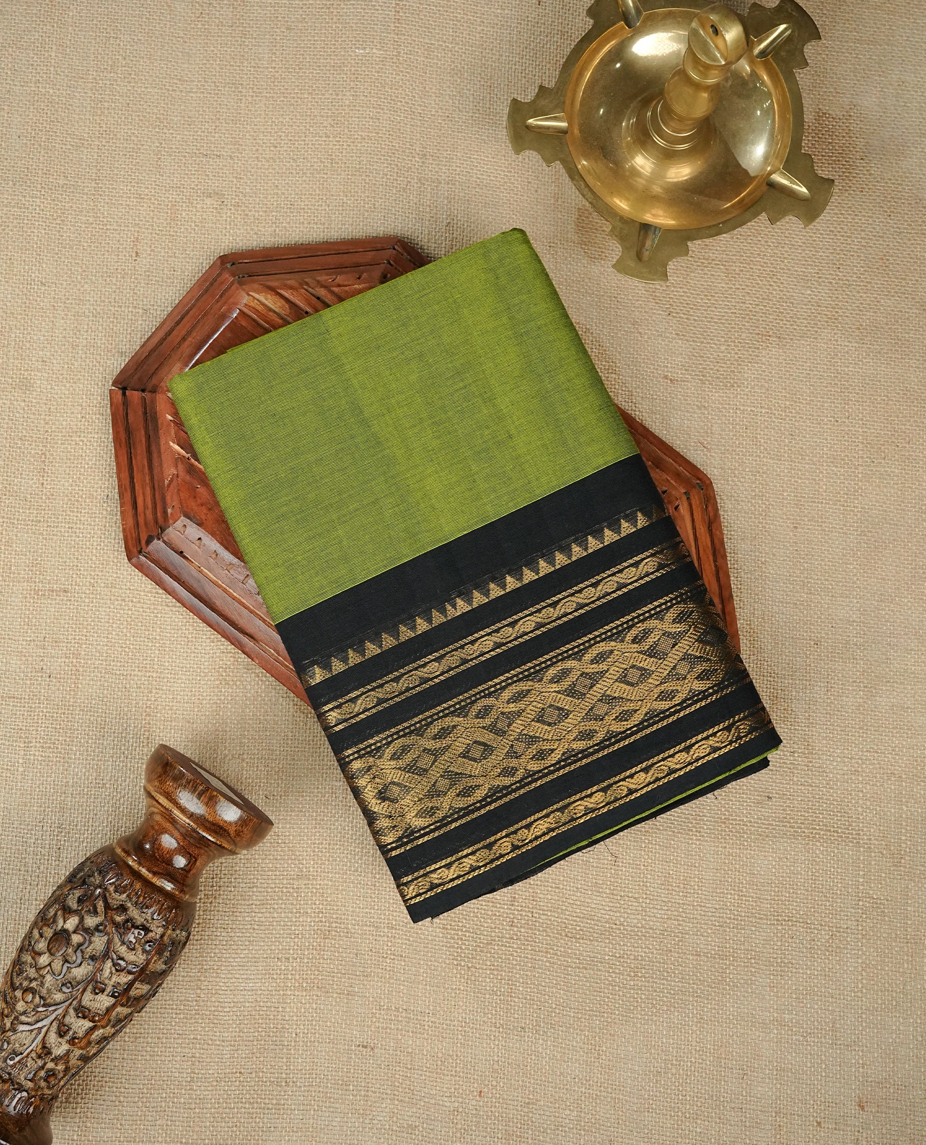 Light Green Colour Chettinad Cotton Saree Featuring a Plain Body, Complemented by a Black Colour with Gold Zari Border and a Striped Pallu, Paired with a Matching Blouse Piece.