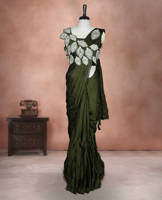 Dark olive colour ready to wear saree featuring bold silver applique embroidery on the drape, paired with a sculpted matching blouse