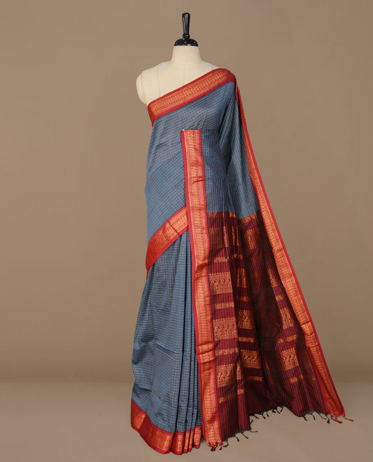 Teal colour kalyani cotton saree featuring antique zari motifs on body, complemented by Maroon colour with Antique zari border, paired with matching blouse piece. (Copy)