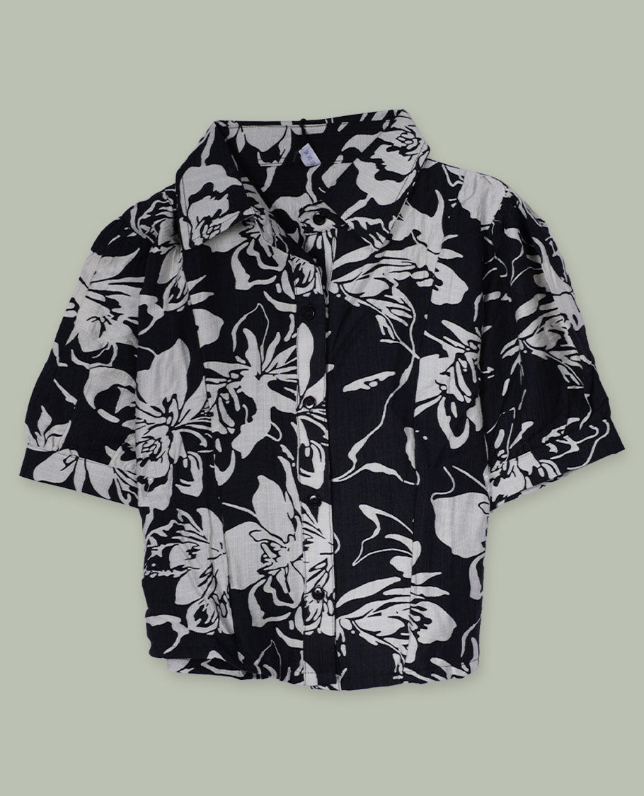Black and white floral printed short-sleeve shirt top with collared neckline, front button placket, and softly gathered shoulders.