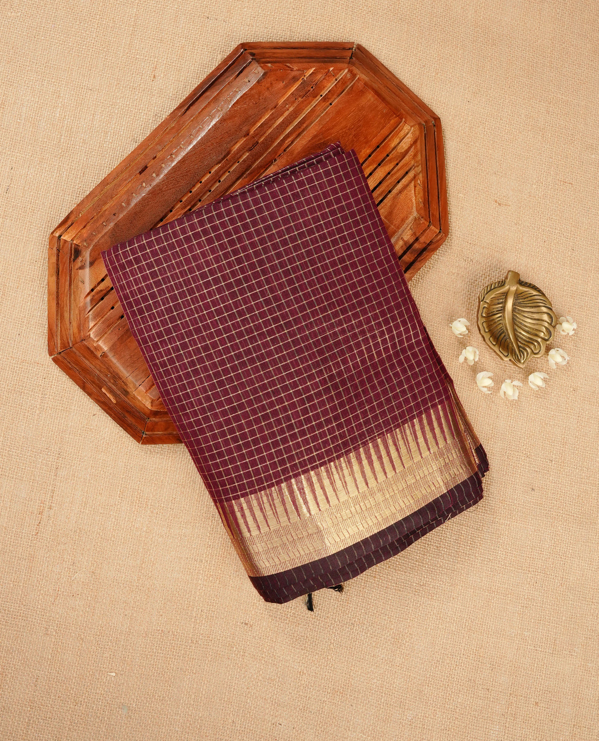 Wine colour Maheshwari cotton saree, gold zari small checks on body, complement self colour gold zari temple design border comes with matching blouse.