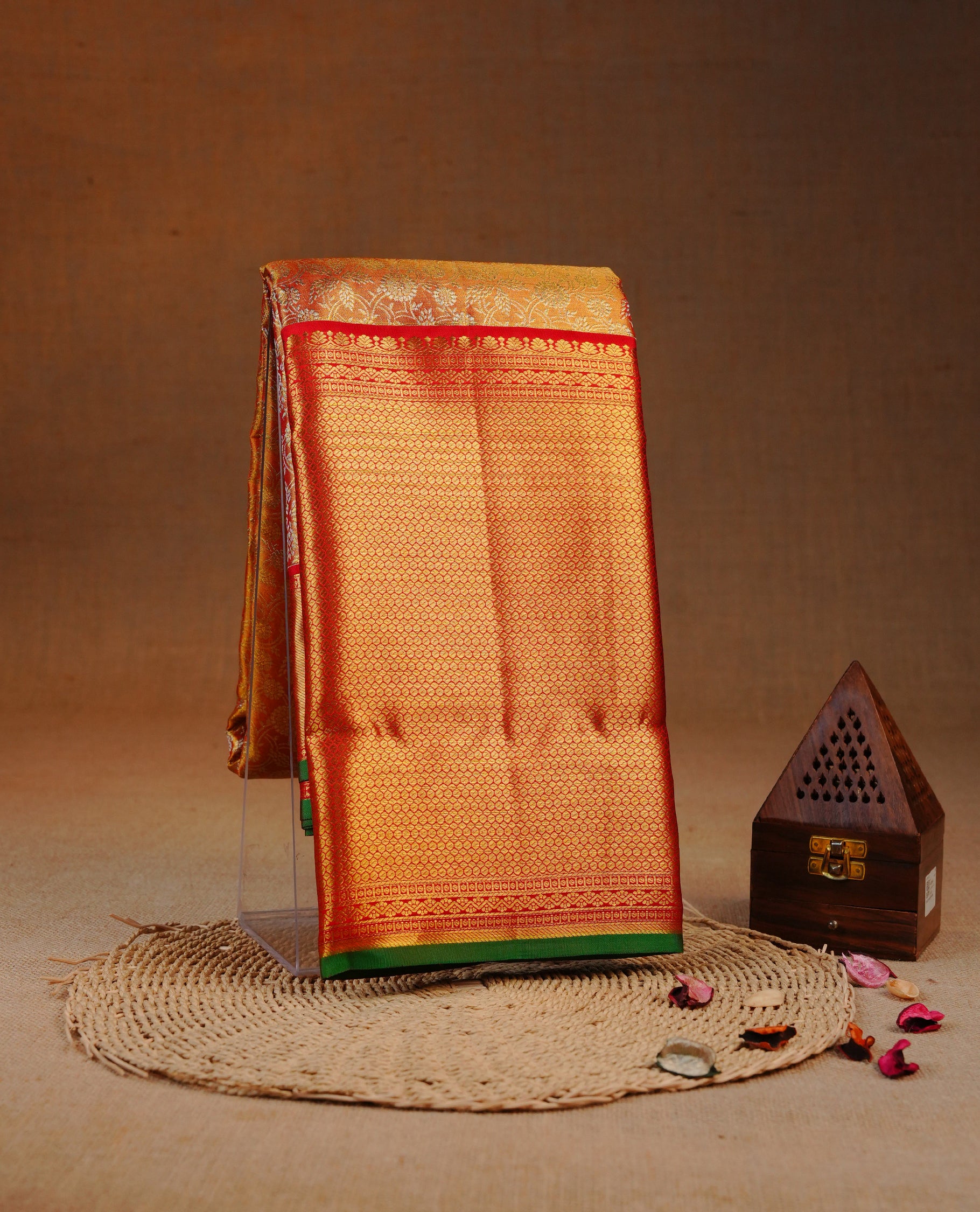 Red & Gold double shade colour Tissue silk saree featuring Silver Kodi pattern on body, complemented by Contrast Red & green With Gold Zari border, comes with matching blouse piece.
