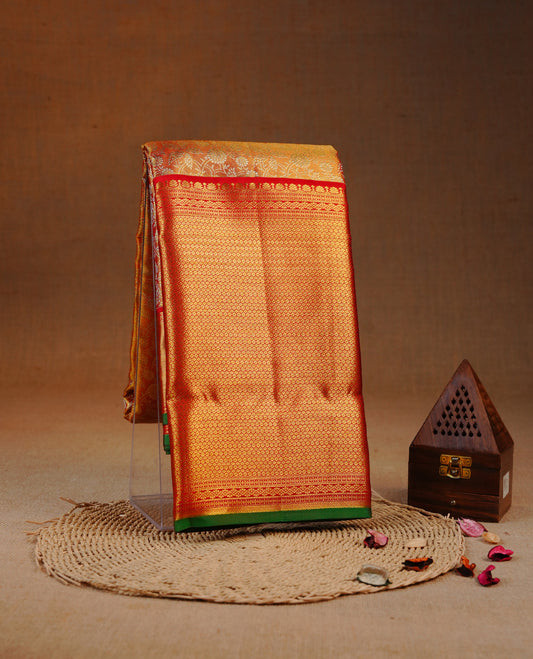 Red & Gold double shade colour Tissue silk saree featuring Silver Kodi pattern on body, complemented by Contrast Red & green With Gold Zari border, comes with matching blouse piece.