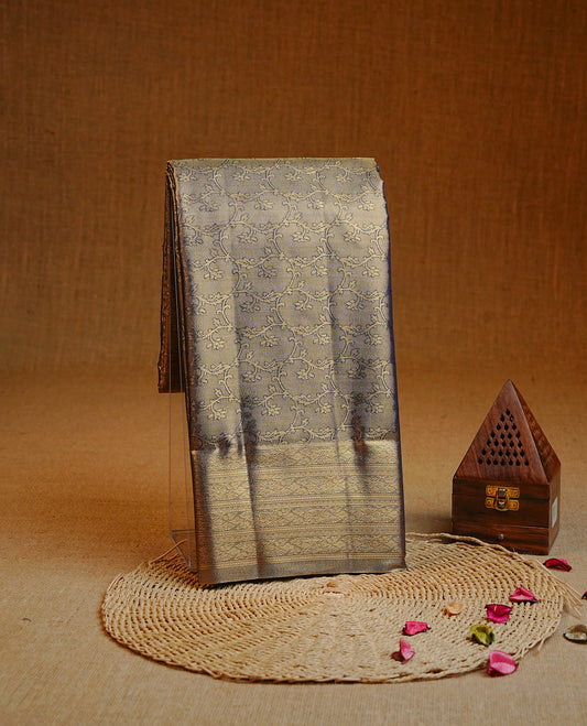 Gold & blue colour Double shade Semi tissue silk saree featuring Gold zari kodi pattern on body, self colour with traditional border, paired with matching.