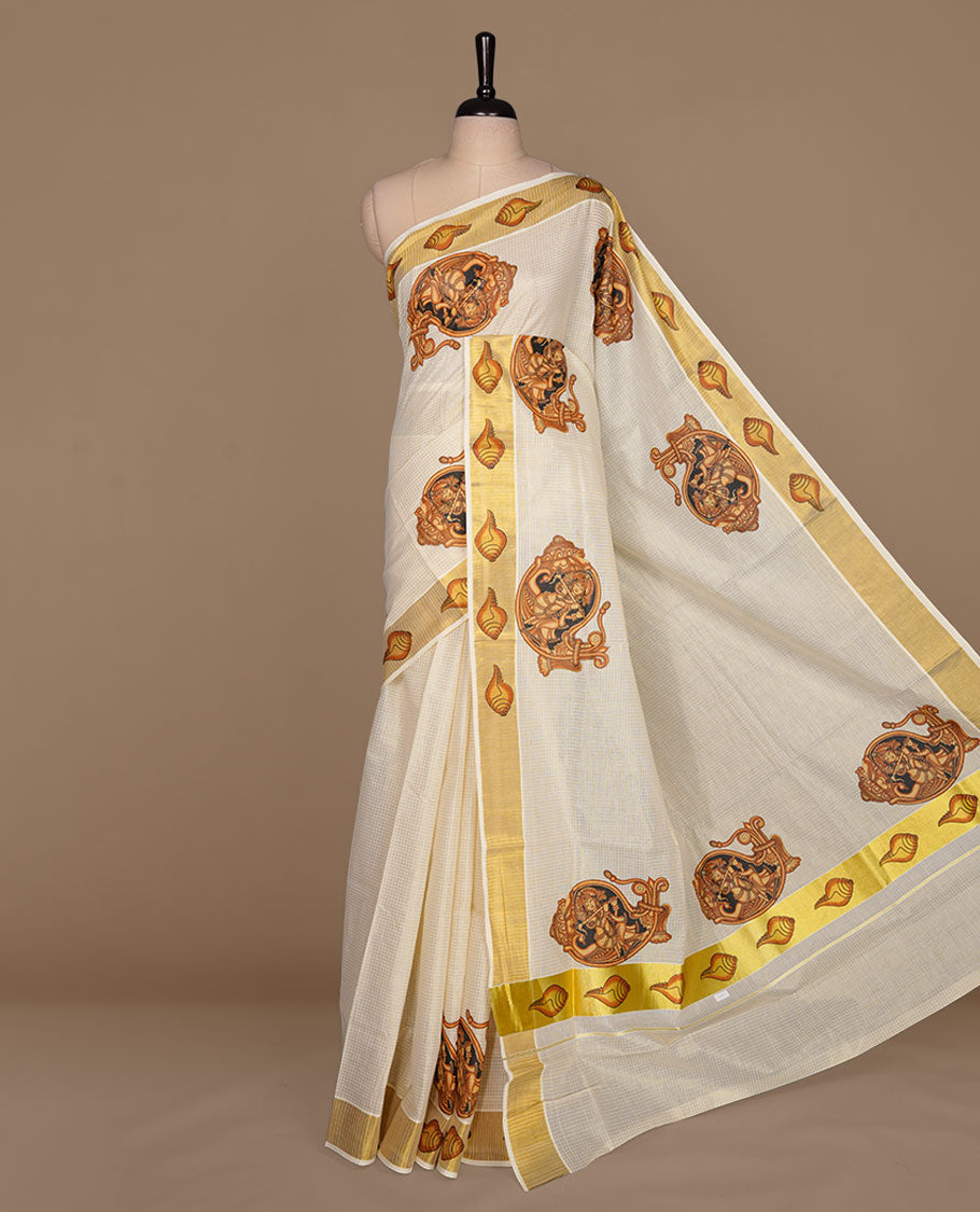 Off white color kerala cotton saree featuring gold zari check on body, complemented by, gold zari with krishna printed border, paired with matching blouse piece.
