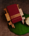 Maroon Colour Cotton Double Dhoti Finished With A Classic Body ,Featuring  Gold Striped  Kara