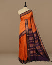 Orange colour kalyani cotton saree featuring Elegant plain body, complemented by Purple colour with Antique zari border, paired with matching blouse piece.