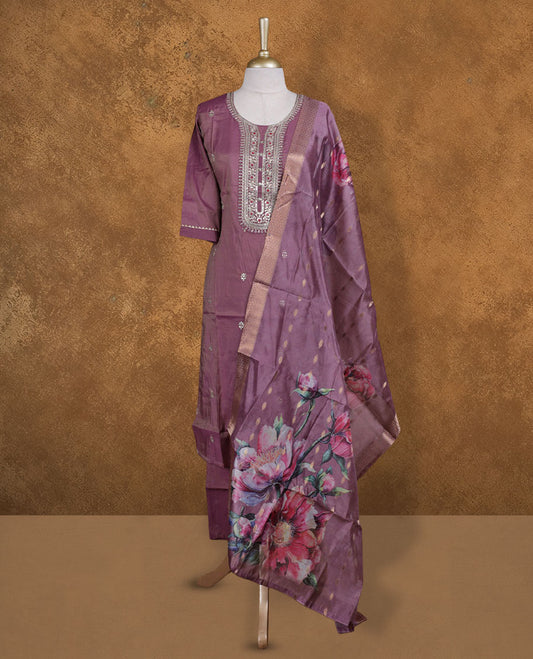 Dusty purple colour churidar set featuring Beats & thread embroidered neckline, sleeves, and Floral pattern body , Paired with a matching dupatta