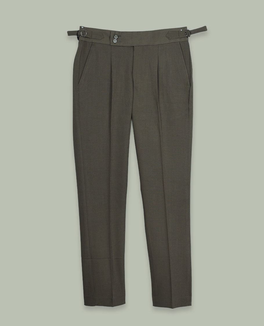 Dusty olive colour men’s pant featuring a clean waistband with side buckle adjusters, neat front pleats, slant pockets and back welt pockets, finished with a straight leg fit.