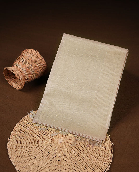 Cream colour semi jute saree highlighting gold zari striped body, without border and paired with matching blouse.