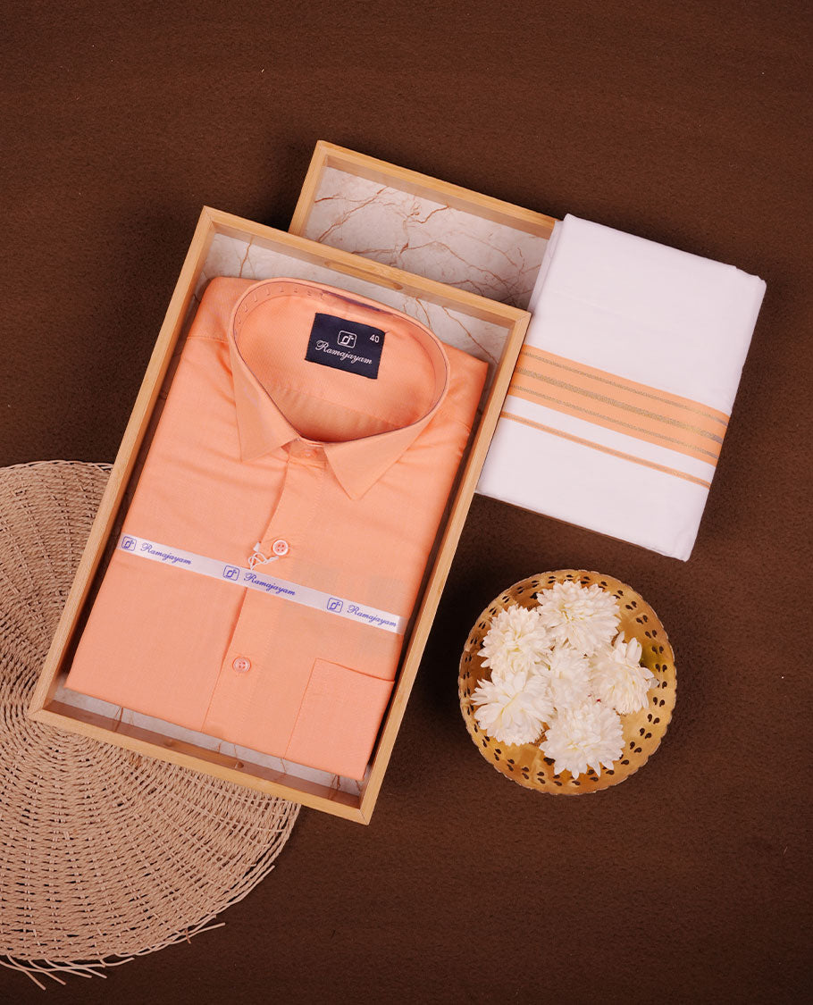 Light orange Colour shirt paired with a matching dhoti, finished with a Light orange and gold border.