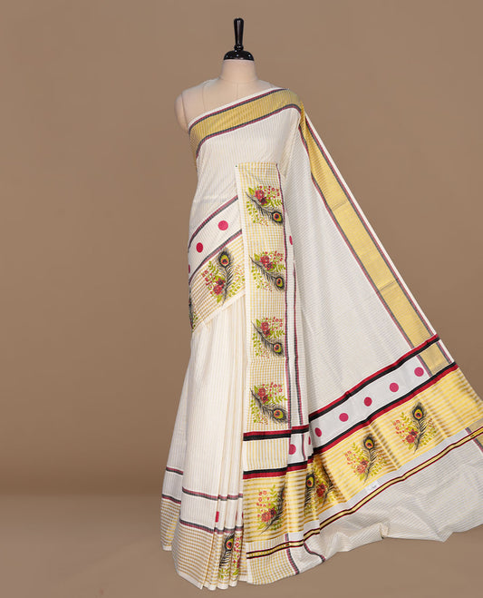 Off white color kerala cotton saree featuring gold zari stripes on body, complemented by Red & black, gold zari with peacock leaf printed border, paired with matching blouse piece.