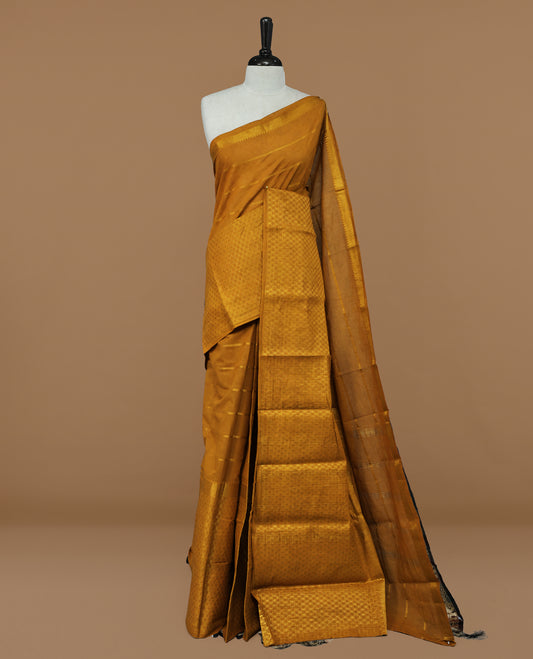 Mustard colour Sungudi cotton saree featuring Gold zari Stripes on body, Gold Small check zari on Self colour border, paired with matching blouse piece.