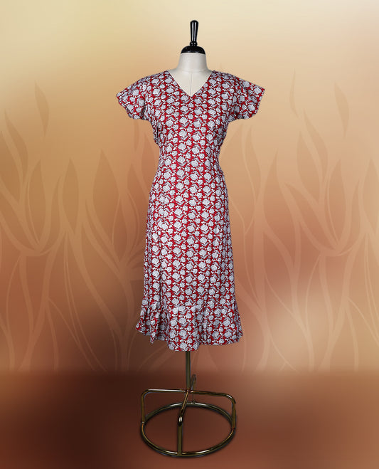Red colour nightwear with a charming white floral print, featuring a V neckline, flutter sleeves, and a flared ruffle hem, A perfect pick for casual days, summer outings, or light festive wear.