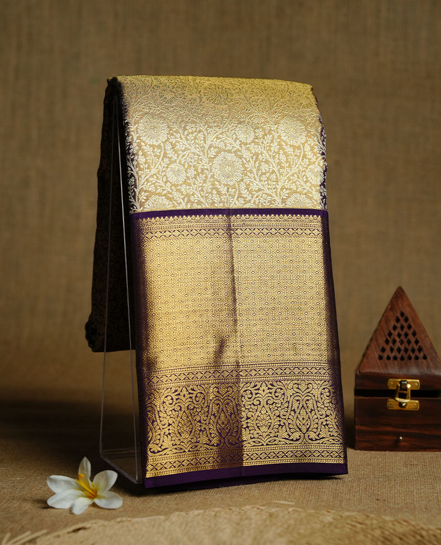 Gold colour kancheepuram tissue silk saree featuring gold zari pattern across body, complemented by contrast purple colour border traditional zari border, paired with matching blouse piece.