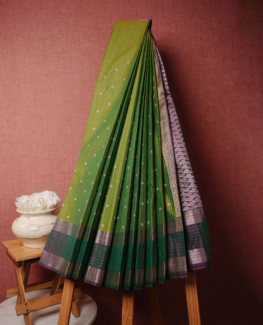Lemon green colour soft silk sareee featuring rose gold zari check pattern on body, complemented by contrast dark green colour with zari border, paired with matching blouse piece.