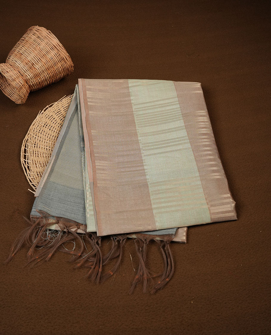 Mustard and pastel green colour semi tussar silk saree, featuring an intricate gold zari stripes on body and pallu , comes with matching blouse.