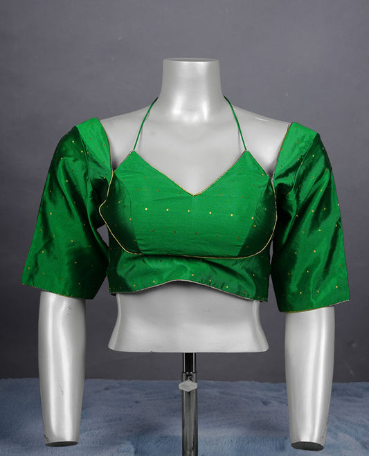 Bright green colour padded blouse with gold polka dots, V neckline, elbow sleeves, and deep tie-up back.