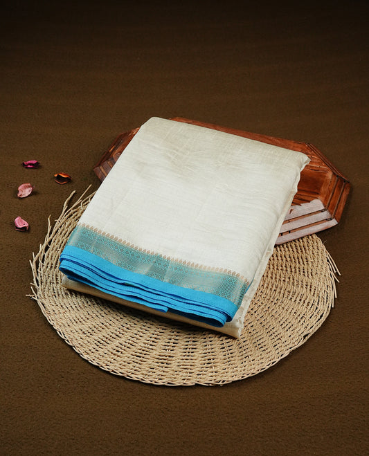 Off white Gold Tussar Saree Featuring elegant plain body, Complemented by contrast Purple colour with gold zari Border, comes with matching blouse piece. (Copy)