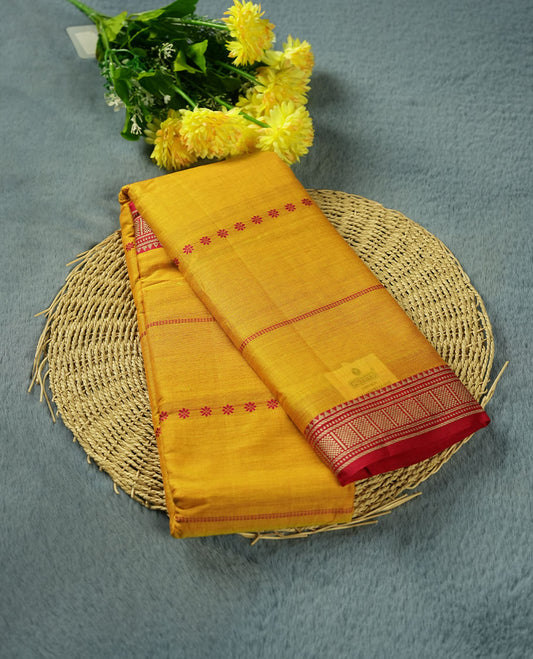 Yellow colour Narayanapattu cotton saree featuring a Rani pink striped pattern on body, contrast Rani pink colour with silver zari border and pallu, pairing a matching blouse piece.