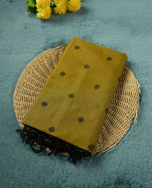 Olive green colour poly cotton saree with black abstract butti motifs on the body, paired with a matching pallu with dense black textured round butta pattern, and a coordinated all‑over textured round butta printed blouse piece.