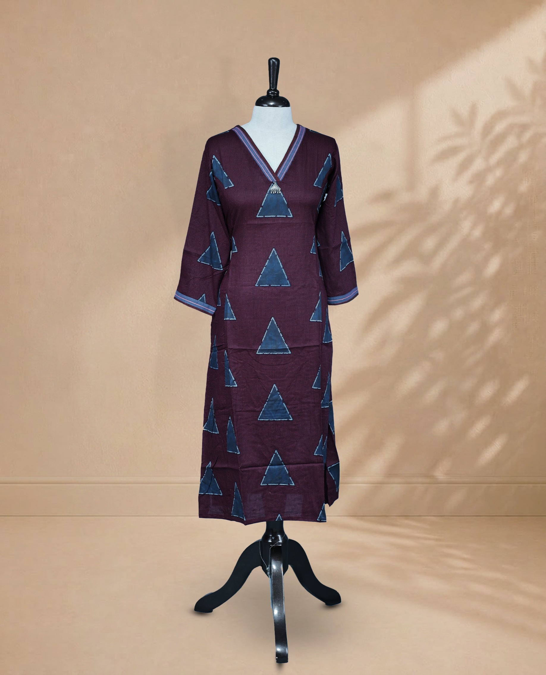 Wine Colour Kurti Featuring Dot & Triangle Pattern On Body ,V-Shaped Neckline  An Thread Detailing On Neck & 3/4 Sleeves