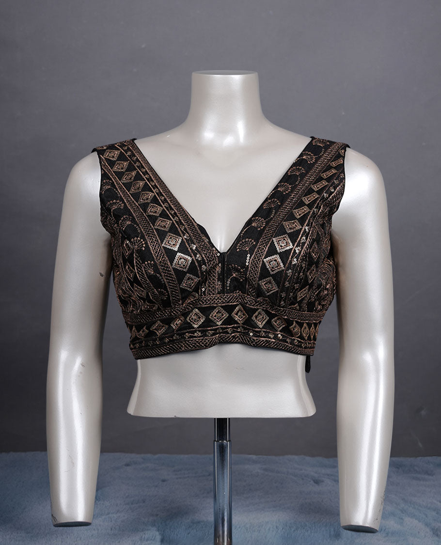 Black colour embroidered sleeveless blouse with intricate geometric motifs, deep V neckline, and tie-up back detailing for a chic finish.