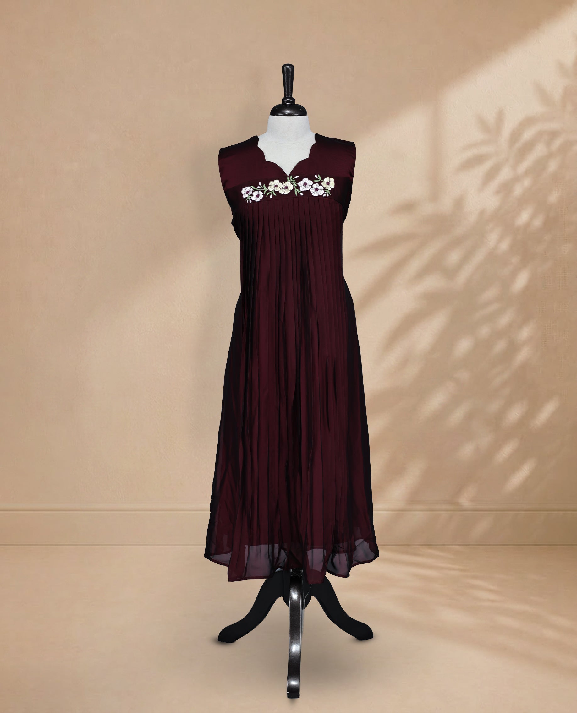Dark Maroon Coloured Sleeveless Kurti Featuring a Designed Neckline, Floral Embroidery on the Body