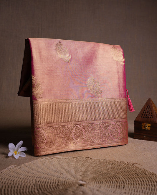 Dual tone peach and dark pink colour tissue brocade saree featuring antique gold zari motifs on the body with a rich traditional zari border and pallu, paired with a matching blouse piece.