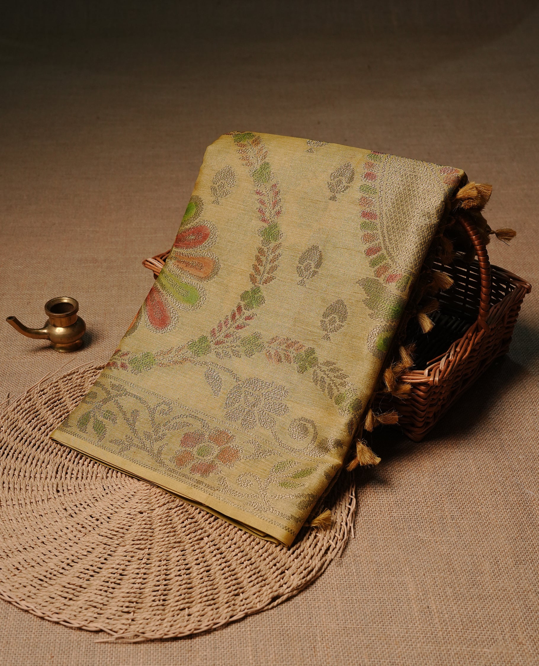Yellow colour pure tussar silk saree featuring elegant antique zari kodi patterns across the body, designed with a graceful borderless finish for a refined look. Paired with a matching blouse piece.