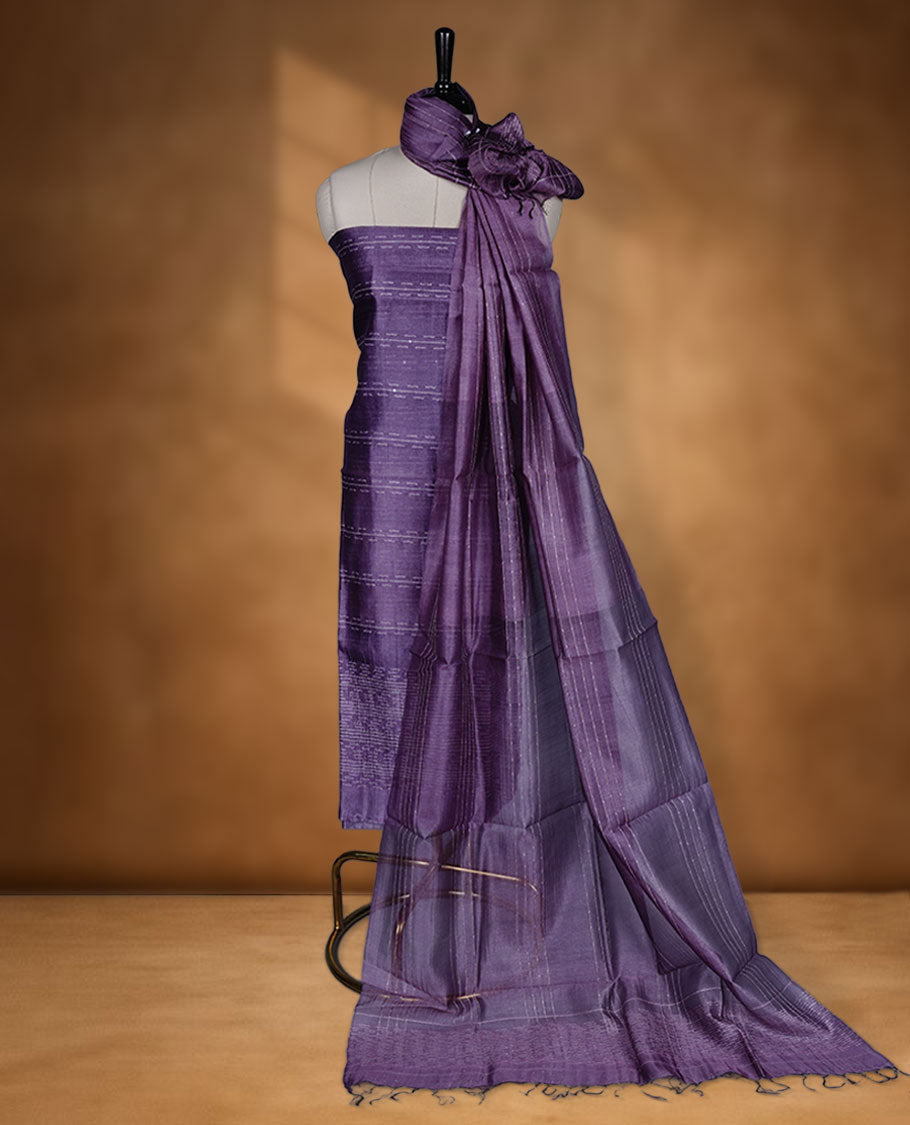 Dark Purple shade Tussar suit material with elegant thread detailing on the body, paired with a plain bottom and a worked Tussar dupatta.