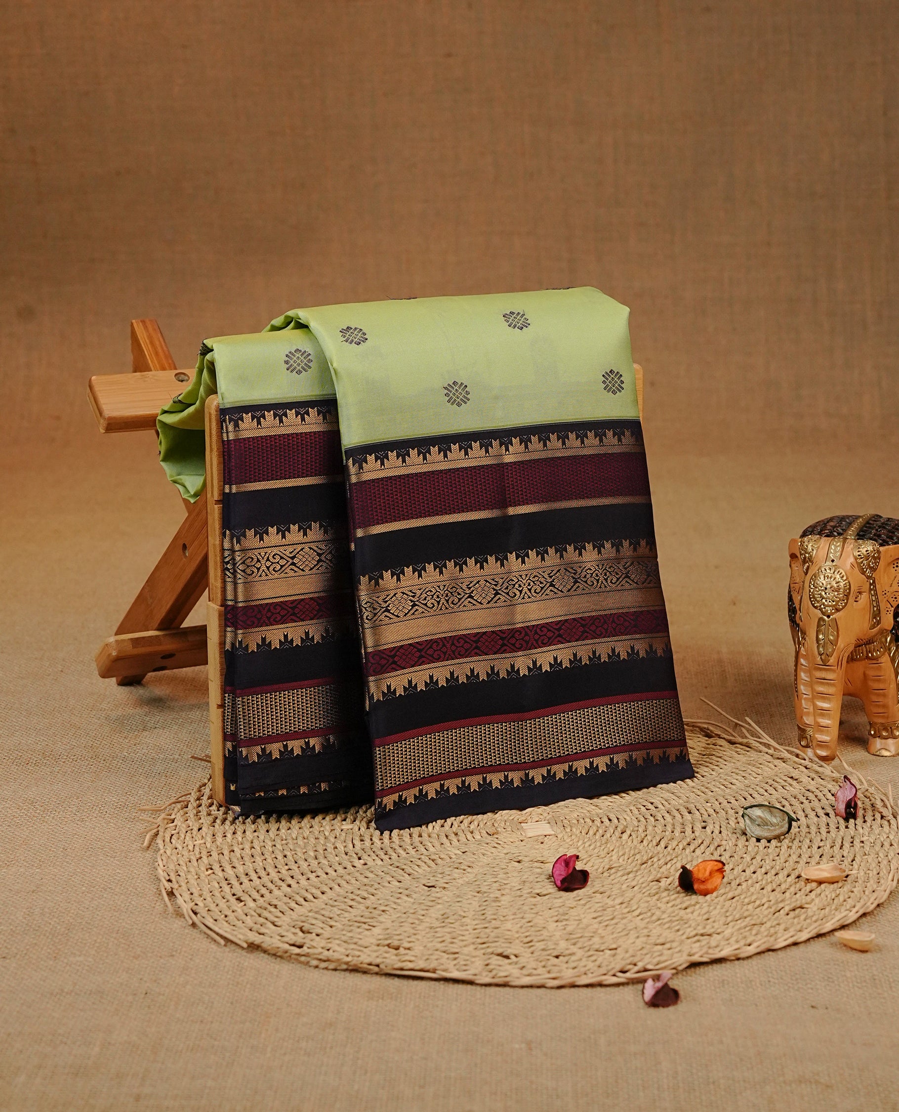 Pastel green colour Kancheepuram silk saree featuring Motifs on body, complemented by Multicolour with Traditional border, comes with matching blouse piece.
