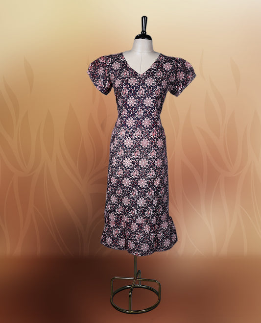 Black colour printed nightwear with soft floral patterns, V neckline, and puff sleeves, The flared hem adds a graceful touch, making it ideal for daily wear, casual outings, or comfy lounge days.