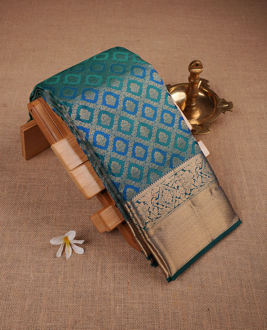 Peacock blue colour Kancheepuram silk saree featuring zari meena jacquard on body with traditional border, paired with matching blouse piece.