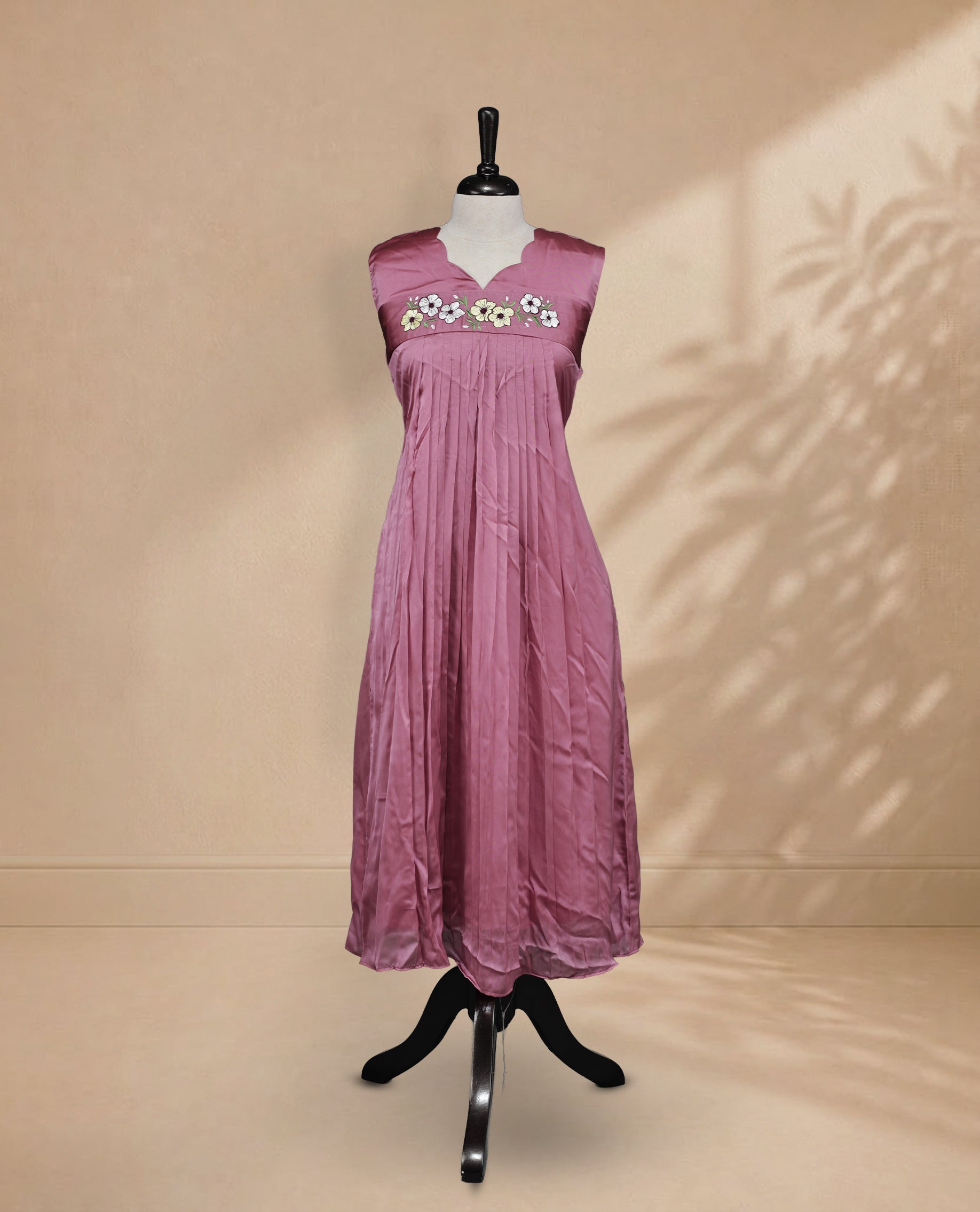 Salmon Pink Coloured Sleeveless Kurti Featuring a Designed Neckline, Floral Embroidery on the Body