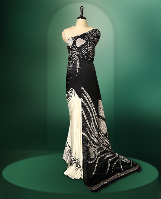 Black and white colour saree featuring abstract patterns with intricate dotted and floral motifs, creating a modern yet graceful look, paired with a matching blouse