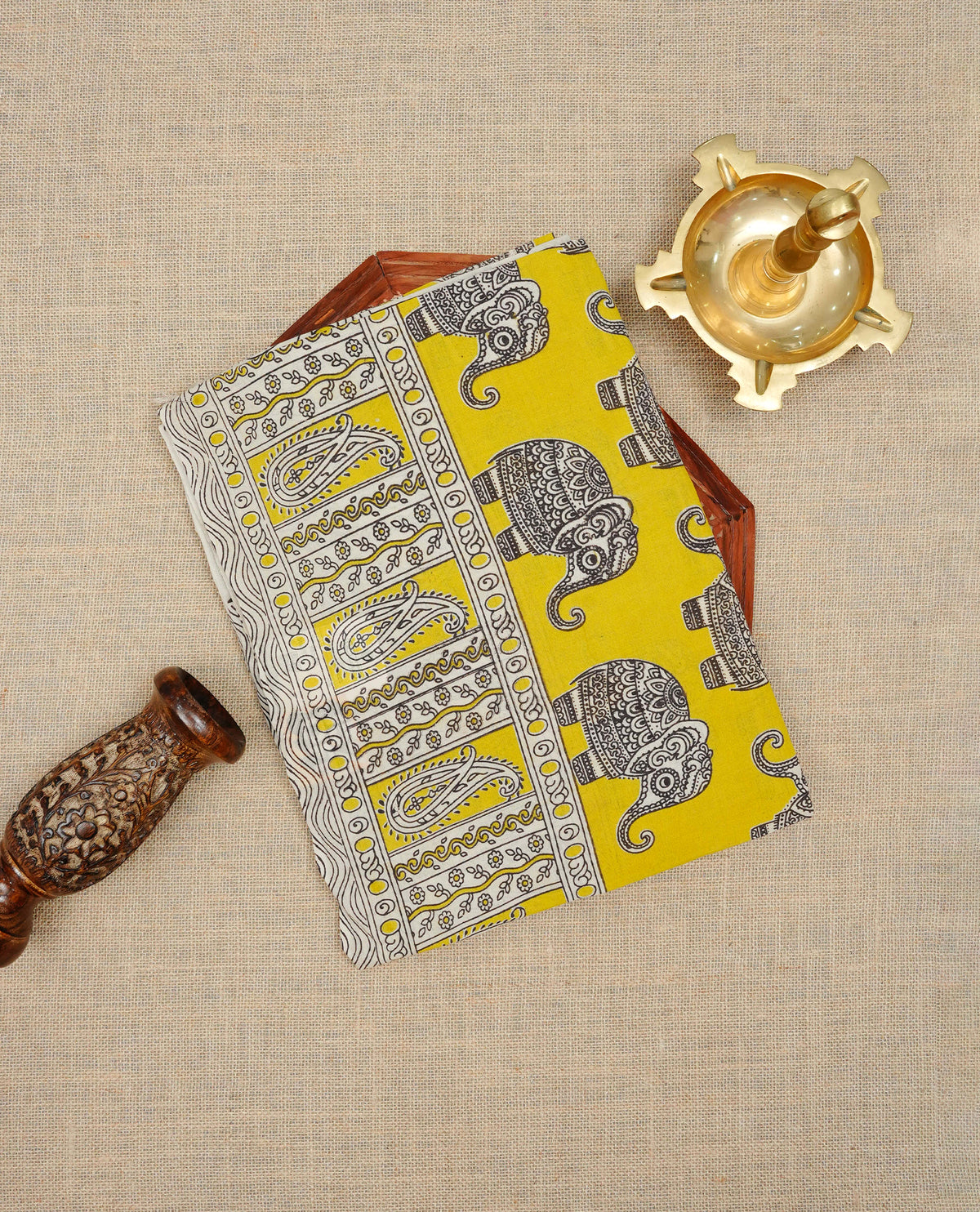 Cream & lime yellow  colour kalamkari cotton saree featuring kalamkari printed body & pallu, paired with a matching  contrast blouse piece.
