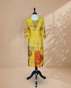Mustard yellow Kurti featuring floral  on the Body , a round neckline with a Floral Embroidery Work,A  vibrant floral printed 3/4 sleeves, and a colourful floral and abstract print along the lower portion.