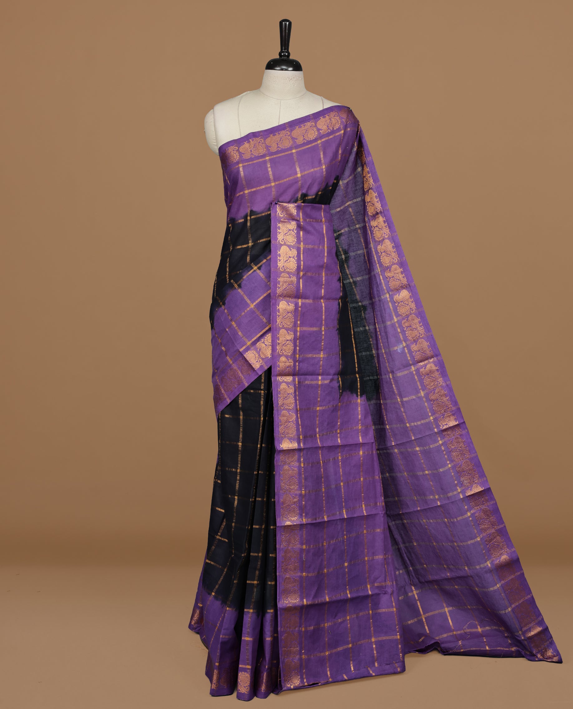 Black colour Sungudi cotton saree featuring Gold zari Check pattern on body, Gold zari Peacock design on Dyed Violet colour design border, paired with matching blouse piece.