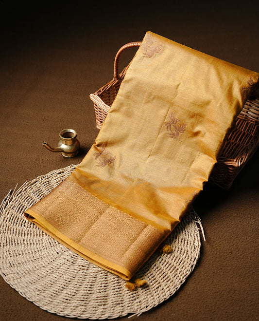 GoldenRod colour semi banaras tussar silk saree highlighting gold zari bird motifs on body, complemented by self colour with antique zari border, paired with matching blouse piece.