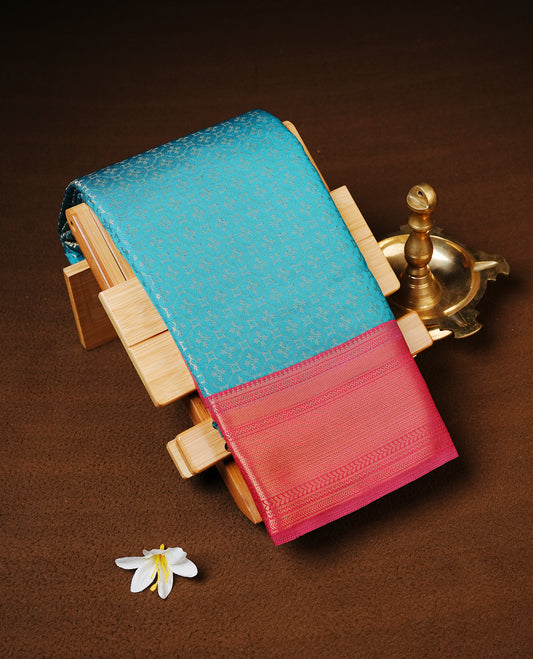 Sea Green Colour Semi wedding silk saree Featuring Gold Zari Pattern across Body, Complemented by Contrast Red Colour With traditional Border, paired with matching blouse Piece.