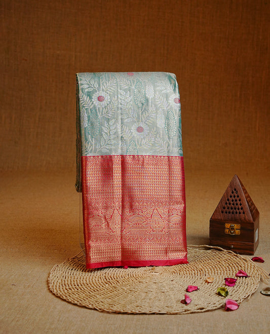 Light Green & gold colour Double shade Semi tissue silk saree featuring gold & silver floral pattern on body, Contrast Red colour with traditional border, paired with matching.