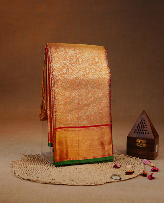Red & Gold double shade colour Tissue silk saree featuring Silver Kodi pattern on body, complemented by Contrast Red & green With Gold Zari border, comes with matching blouse piece.