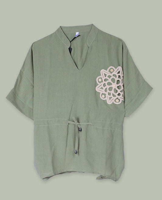 Olive green short-sleeve top with V-slit band neckline, contrast beige crochet motif on one side, and adjustable drawstring at the waist.