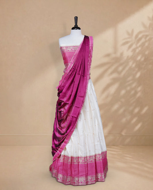 Cream colour Half saree featuring Gold zari buttas on skirt with Zari border on contrast Magenta colour border, Unstitched Blouse and matching dupatta.