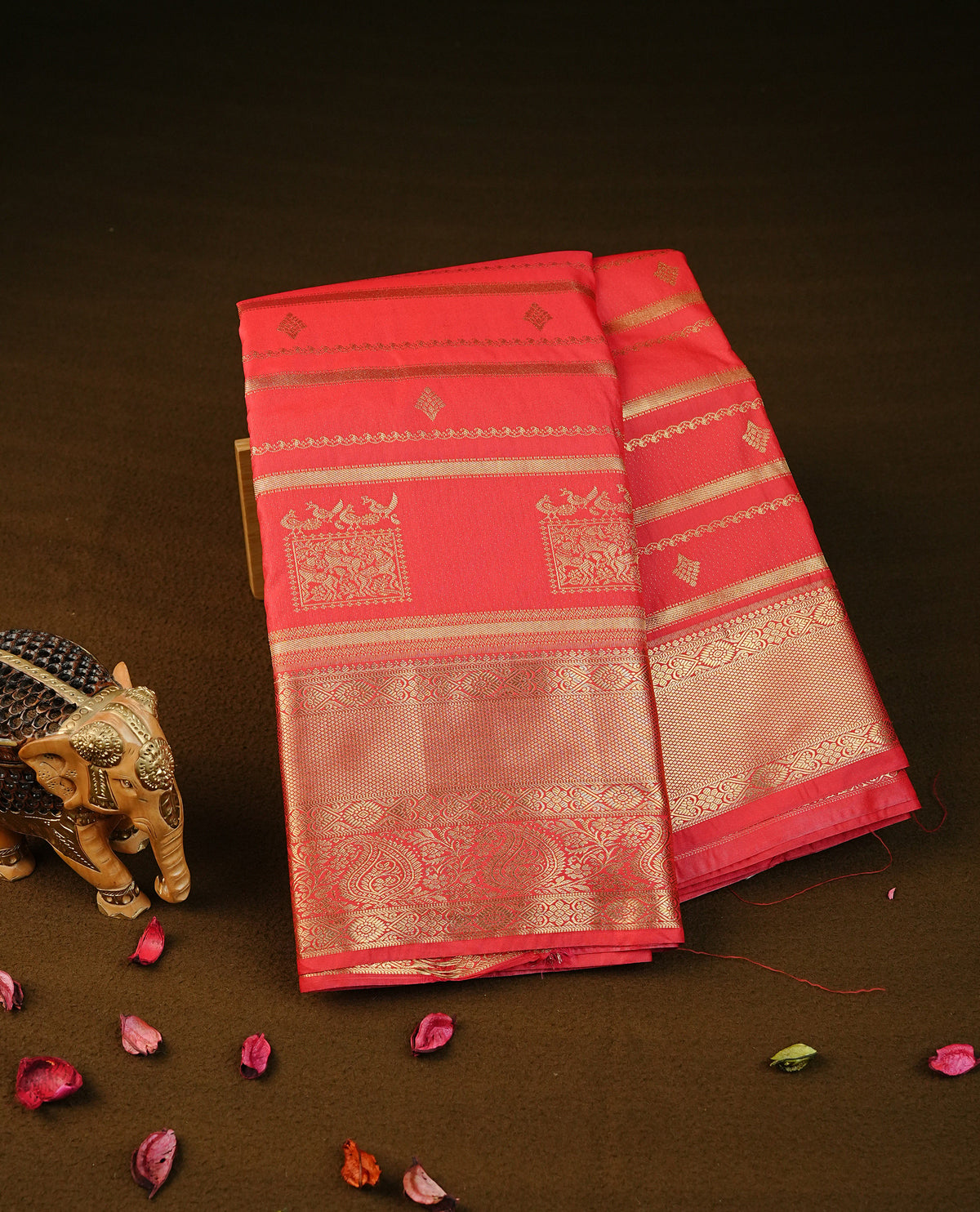 Red colour semi wedding silk saree featuring gold zari with stripes & buttas on body, contrast self colour traditional border on body, rich pallu comes with matching blouse piece